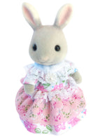 sylvanian mothers dress.Pretty pink floral print on a white background.Has pink wide lace around the skirt,and white narrow lace around the waistline.The bodice has white frilled lace around the neckline.Velcro at the back.